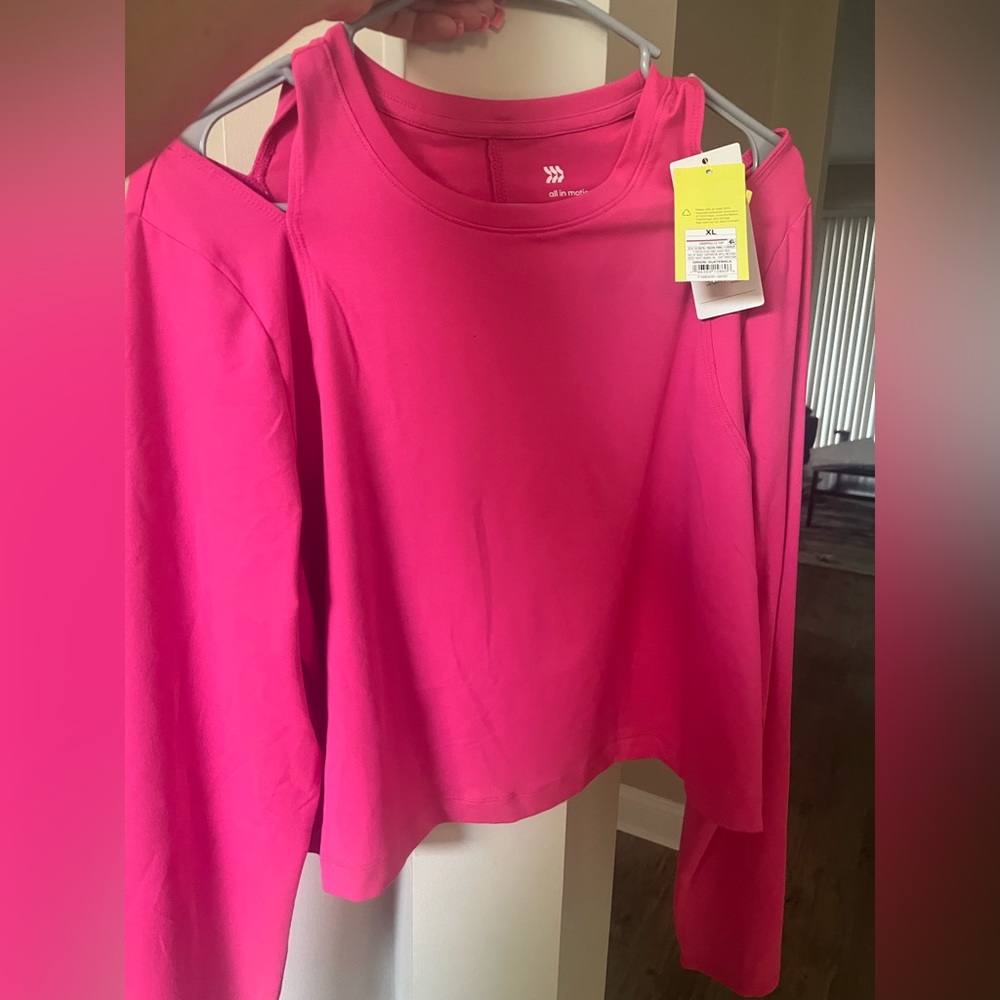 Barbie Pink athletic crop top with small shoulder cut out.